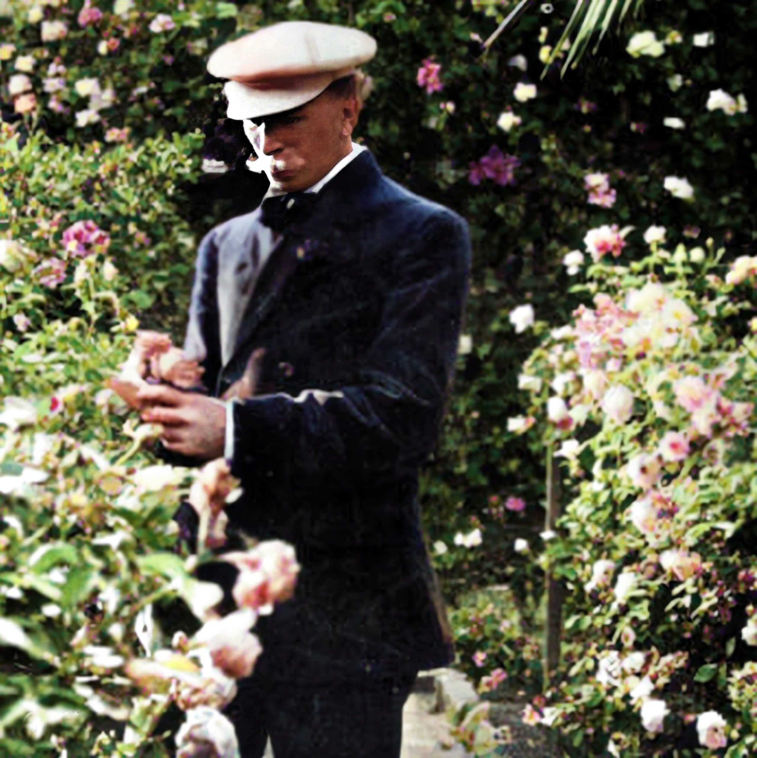 Paul de Longpré inspecting roses - enhanced and colorized