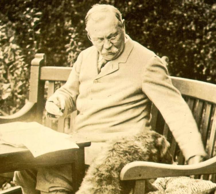 Sir Arthur Conan Doyle in the Garden with his dog
