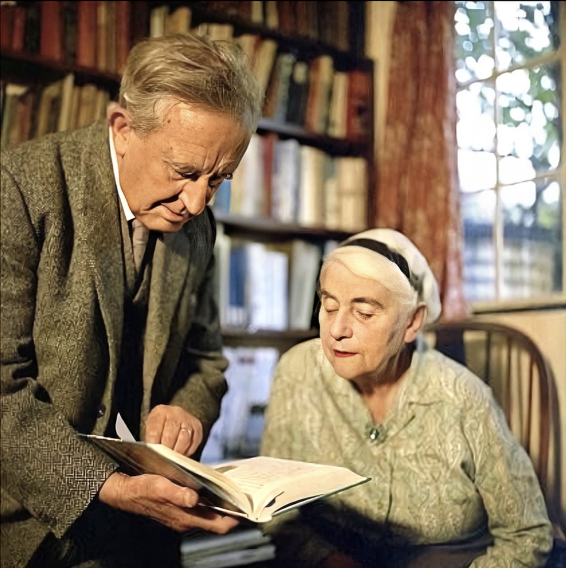 J. R. R. Tolkien looks at a book with Edith by Pamela Chandler 1961